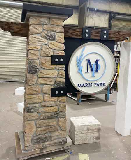 Marris Park Stone Column Sign on Wood Beam