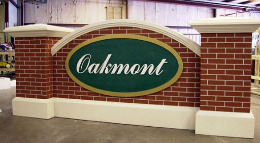 Monument Model #10 HOA entrance sign with faux brick and blasted logo panel