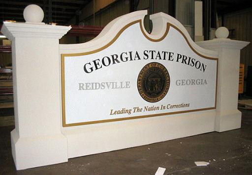 Monument Model #03 State prison main entrance sign monument with carved shield