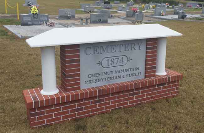 Cemetery Sign Monument with Faux Brick, Faux Granite Tombstone, Stucco Columns and Stucco Roofline Cap