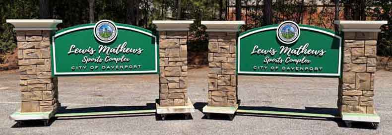 City of Davenport FL break-away sign monuments with faux stone columns.