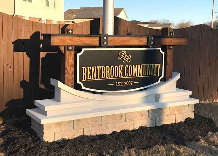 Coastal Community Entrance Sign Monument with Faux Wood Beams and Iron Hardware