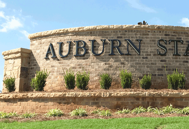 Sign Letters with Gold Inlay on Curved Brick Wall - Auburn Station